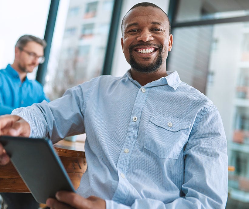 About Skill Up_0001_technology-has-really-simplified-way-we-business-portrait-businessman-using-his-tablet-with-colleagu